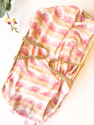 Organic Pink Sun + Wave Baby Swaddle | Coastal Nursery Decor