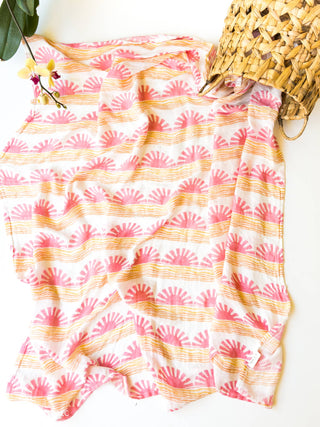 Organic Pink Sun + Wave Baby Swaddle | Coastal Nursery Decor