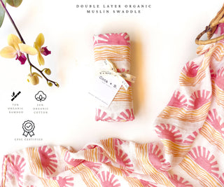 Organic Pink Sun + Wave Baby Swaddle | Coastal Nursery Decor