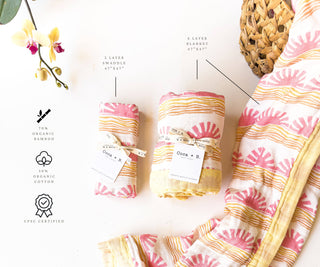 Organic Pink Sun + Wave Baby Swaddle | Coastal Nursery Decor