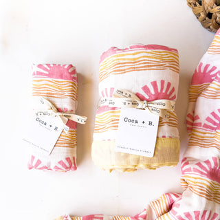 Organic Pink Sun + Wave Baby Swaddle | Coastal Nursery Decor