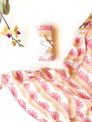 Organic Pink Sun + Wave Baby Swaddle | Coastal Nursery Decor