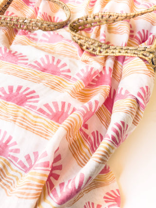 Organic Pink Sun + Wave Baby Swaddle | Coastal Nursery Decor